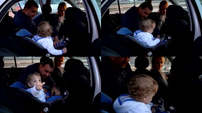 父亲修理婴儿汽车安全座椅并上车
