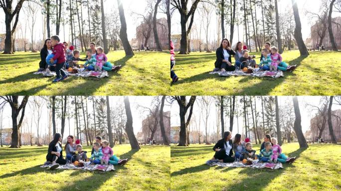 快乐的家人和朋友在公园野餐