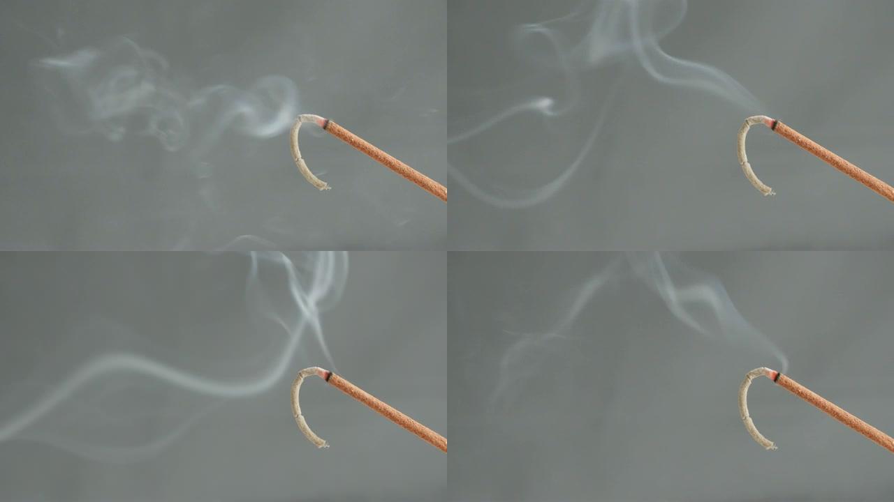 燃烧的香香棒散烟的特写4K 2160p 30fps超高清镜头-燃烧芳香生物材料用于冥想目的3840x