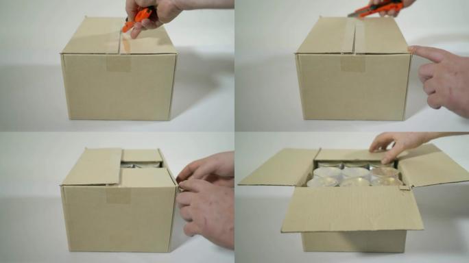男子打开装有罐头食品的纸板箱