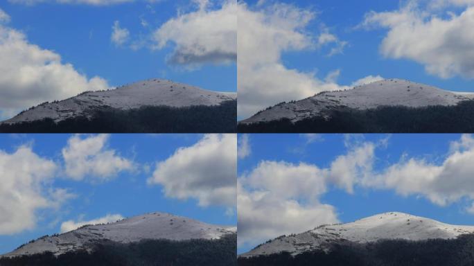 在法国比利牛斯山的白雪皑皑的土地上移动云层的时间流逝