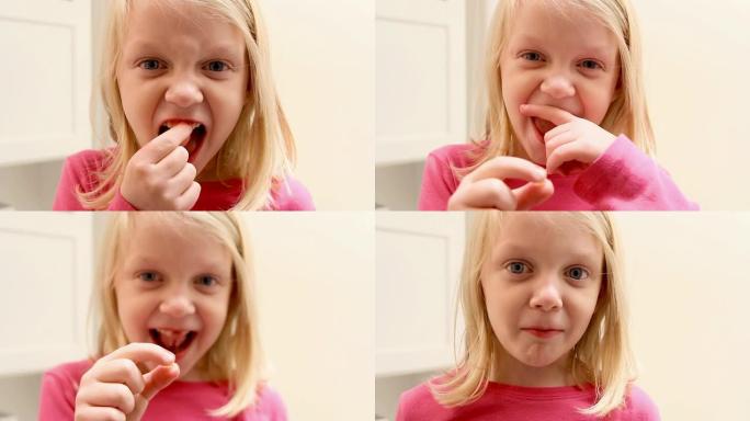 小女孩露出她的牙齿