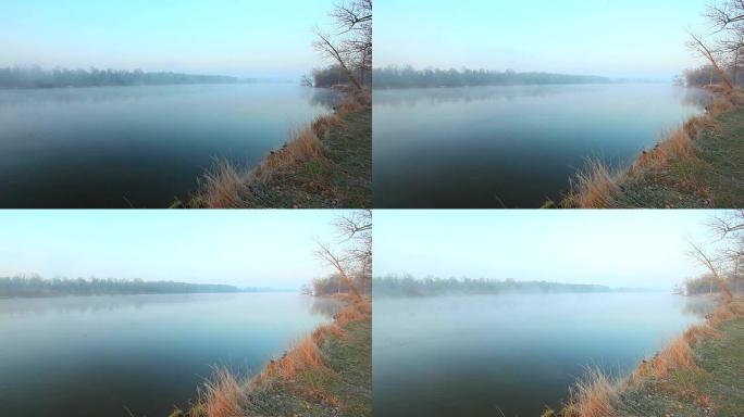 河雾。美丽的早晨风景。时间流逝