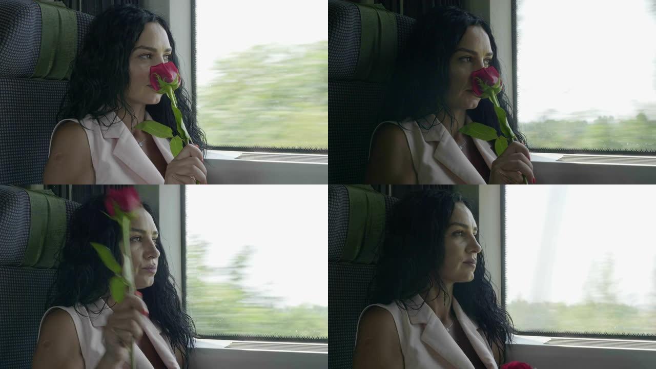 浪漫的年轻女子闻到玫瑰，在火车上离开的窗外看起来很体贴