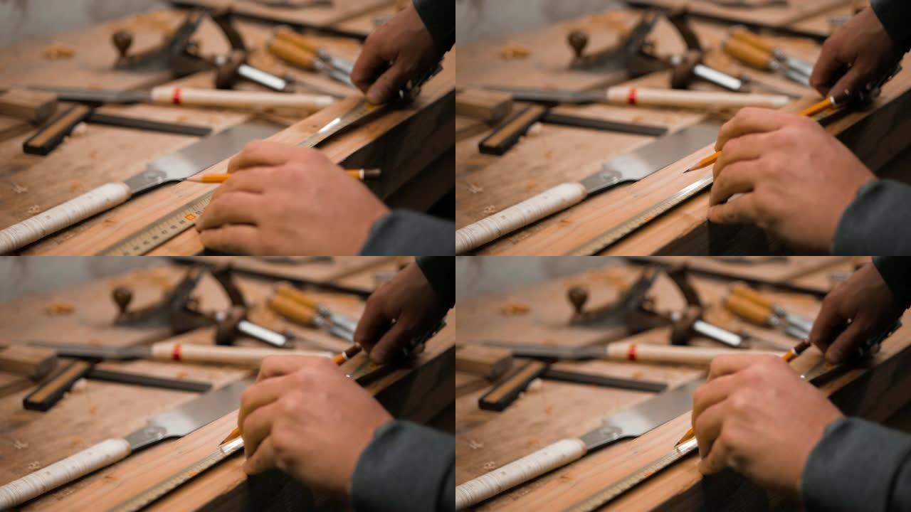 木匠用卷尺和铅笔标记工件