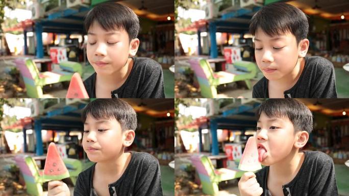 亚洲小男孩喜欢吃冰激赏。