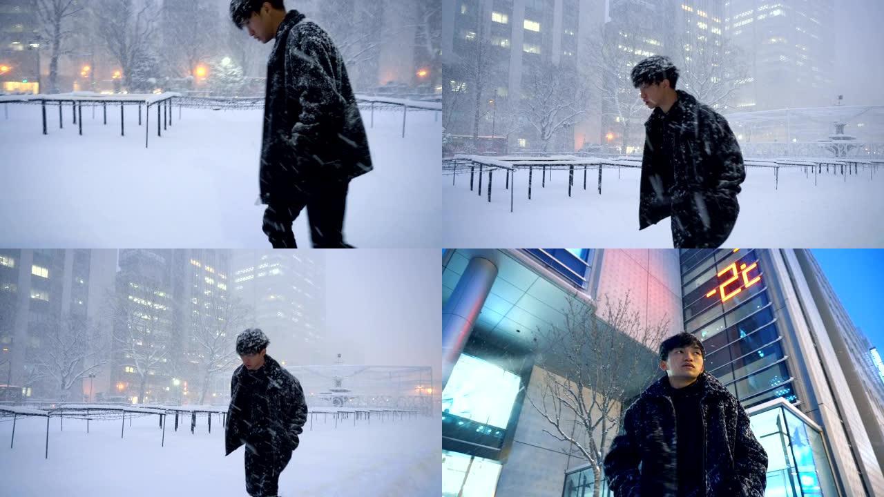 2个剪辑-亚洲男子在城市环境中寒冷的天气中挣扎
