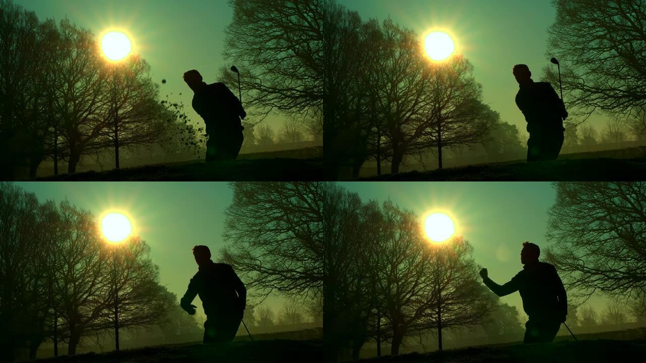 一名高尔夫球手在日出时从沙坑中打出一记好球。