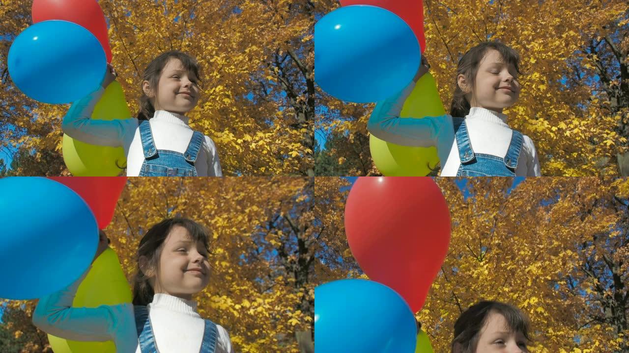 秋天公园里有气球的孩子。
