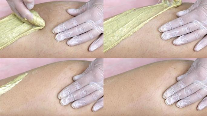 美容院中腿部脱毛的女人，特写镜头