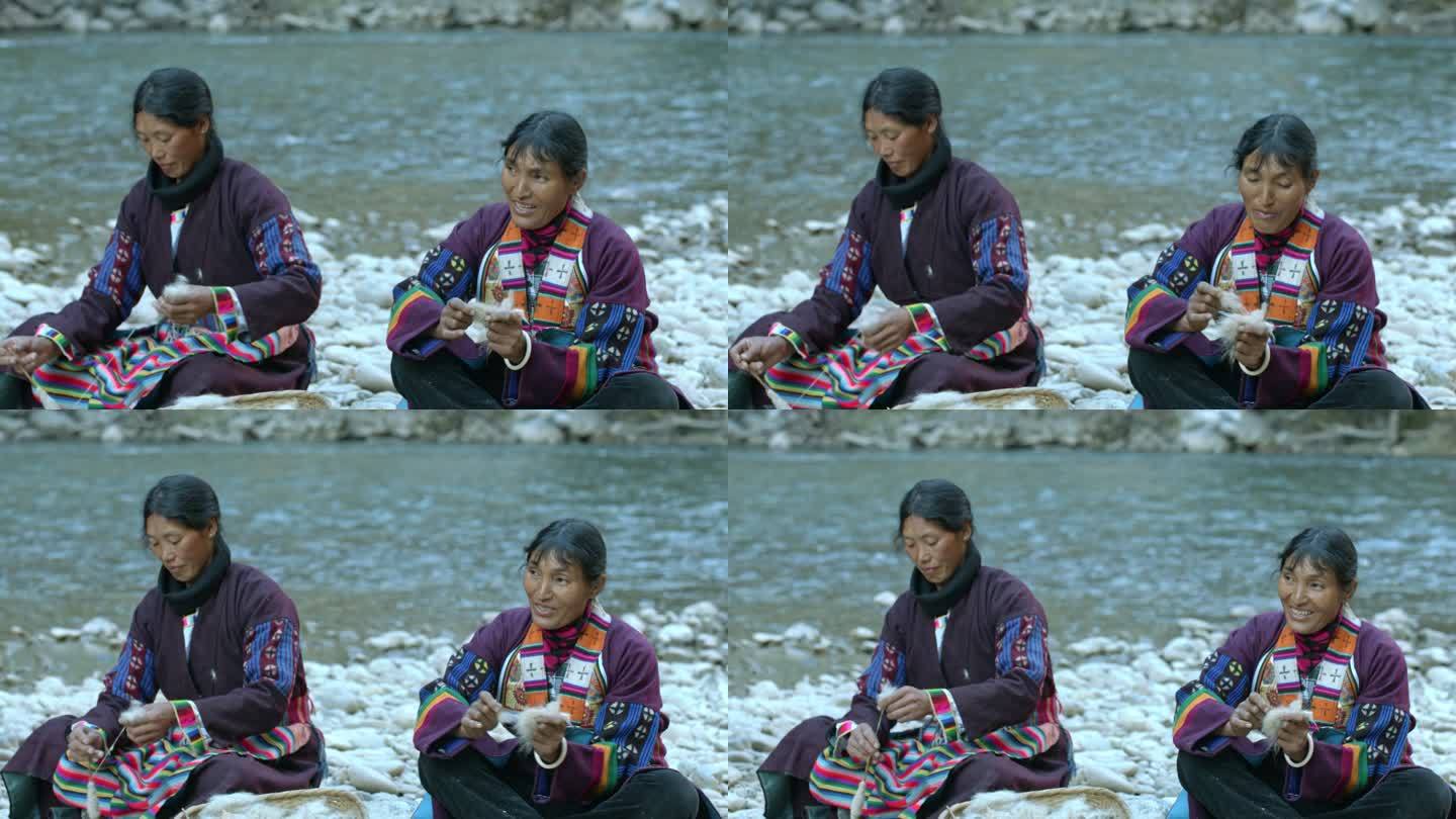 藏族妇女河边纺线劳作生活