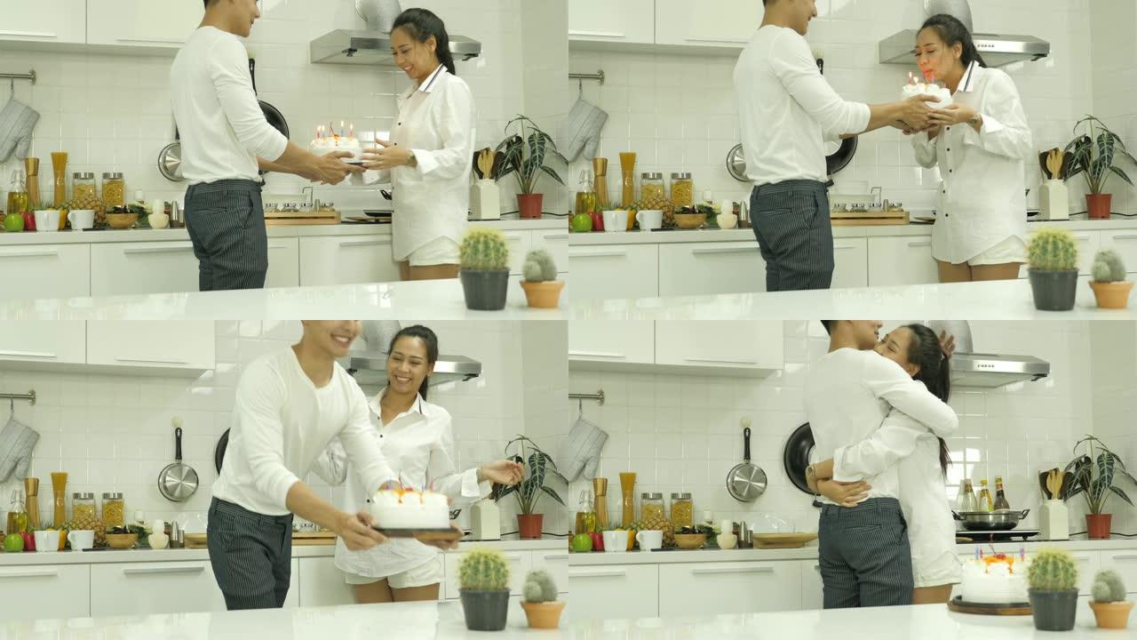 一个男人在家里的厨房里给女友生日蛋糕