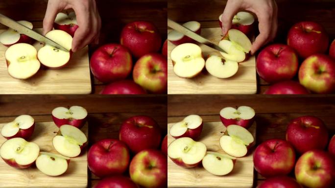 人在砧板上把苹果切成薄片。