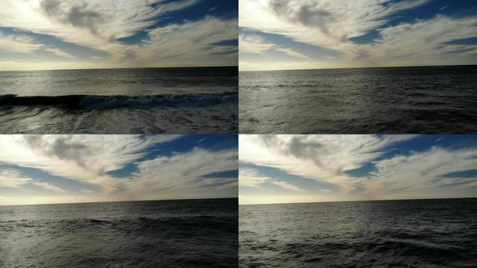 美丽的镜头低空飞过海滩，飞向加利福尼亚州圣克莱门特的水面