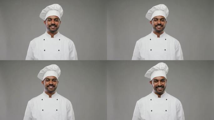 男性印度厨师在灰色背景上