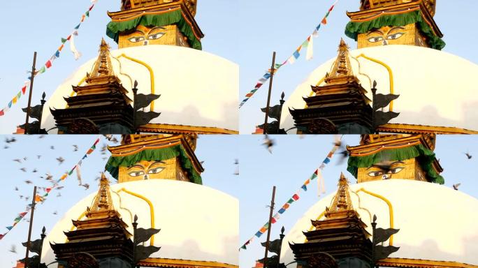 五颜六色的祈祷旗在佛塔寺、圣塔、尼泊尔和加德满都的象征下，用佛陀的眼睛在风中摇摇欲睡。日落之光。藏传