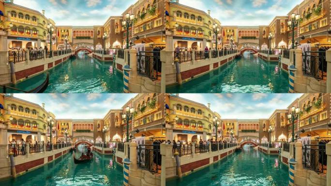 游客在具有威尼斯风格的建筑风格的运河上巡游吊船