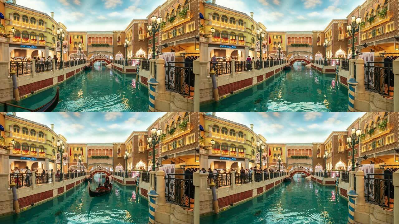 游客在具有威尼斯风格的建筑风格的运河上巡游吊船