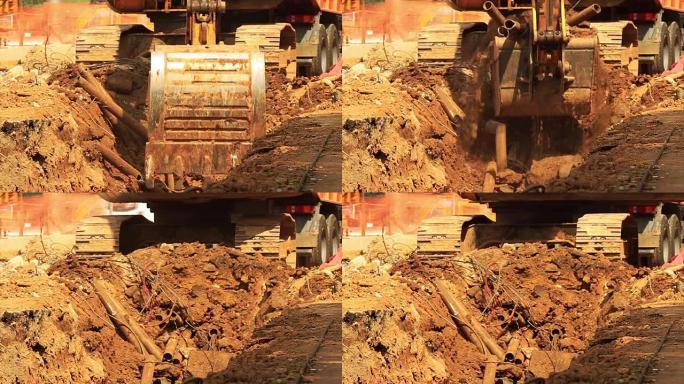 建筑工地的黄色挖掘机。