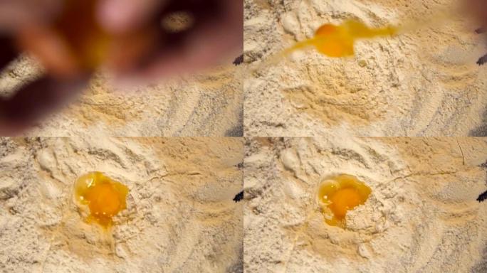厨师手把鸡蛋扔在一堆面粉上。慢动作