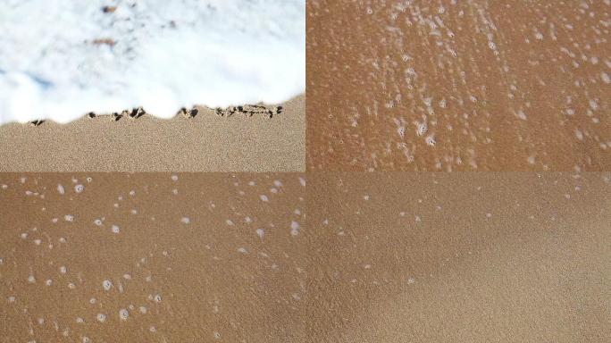 沙子里画的 “和平” 一词