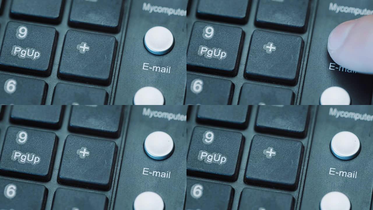 电子邮件。电脑键盘按钮上电子邮件信封图标的特写。