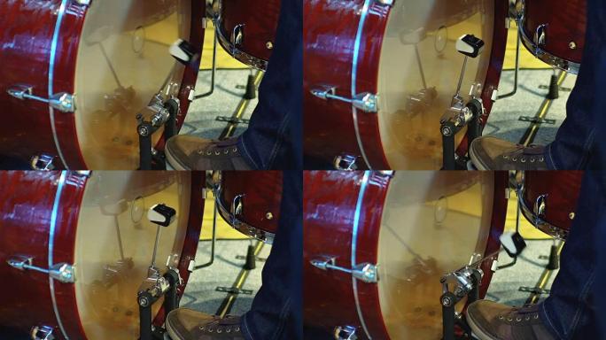 鼓手的脚移动鼓低音踏板的特写镜头，慢动作