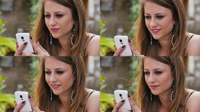 一个美丽的女孩正在用手机发短信: 智能手机，聊天，facebook