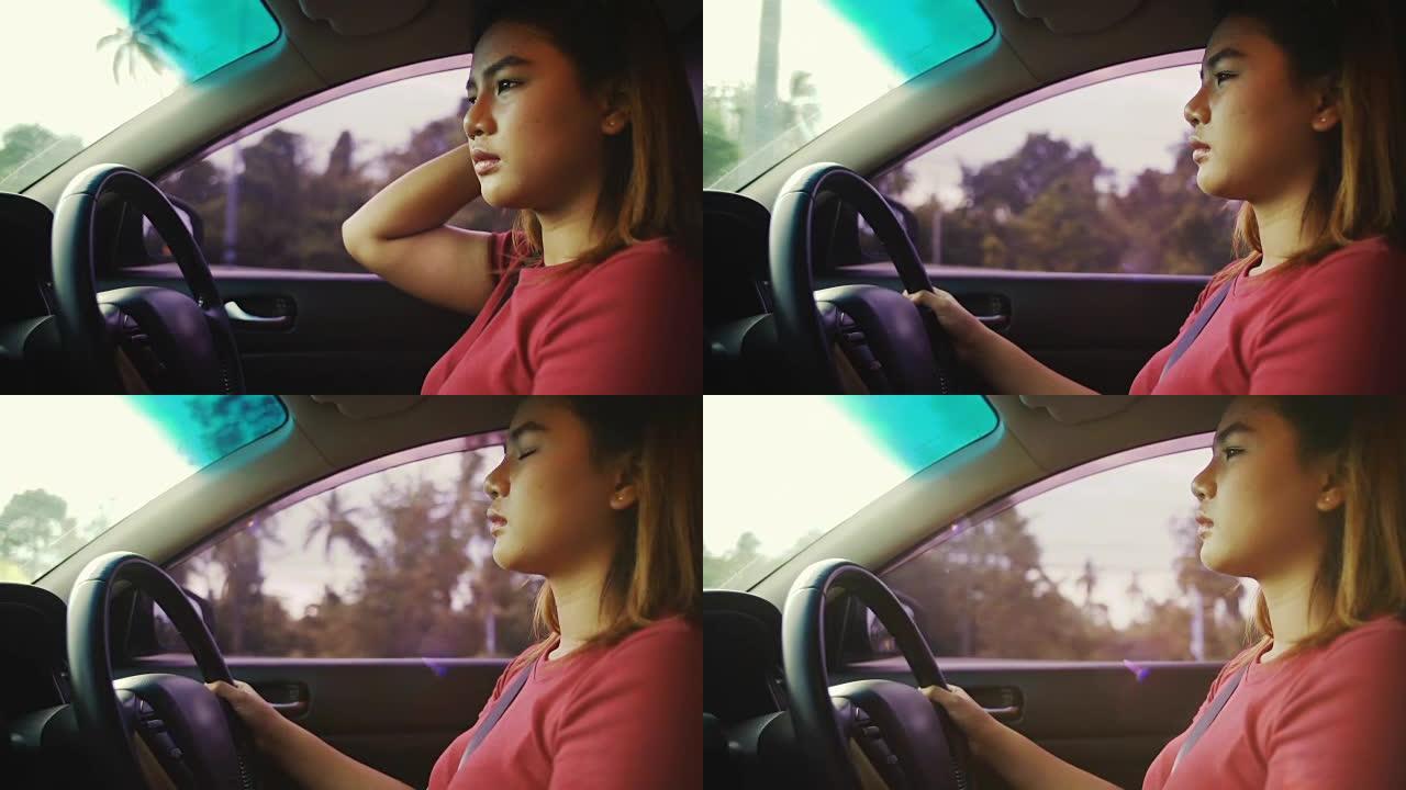 年轻女子驾驶汽车慢速行驶