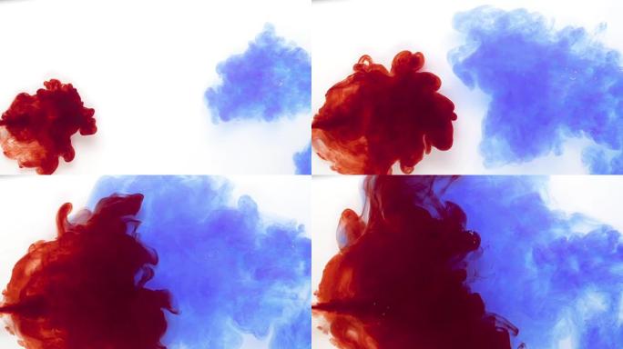 白色背景上彩色的蓝色和红色墨水混合
