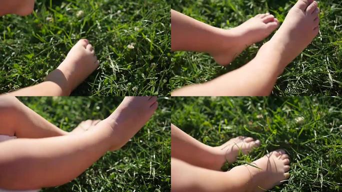 孩子们赤脚在草地上跺脚。户外乐趣
