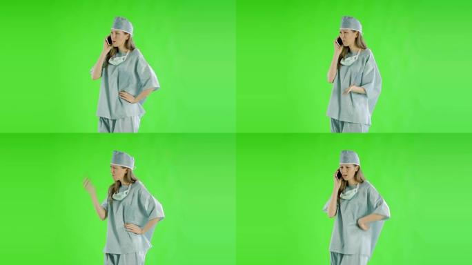 白种妇女绿屏剪出医生保健护士的手术服