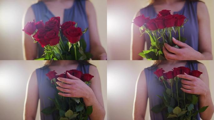 女人拿着一束红玫瑰