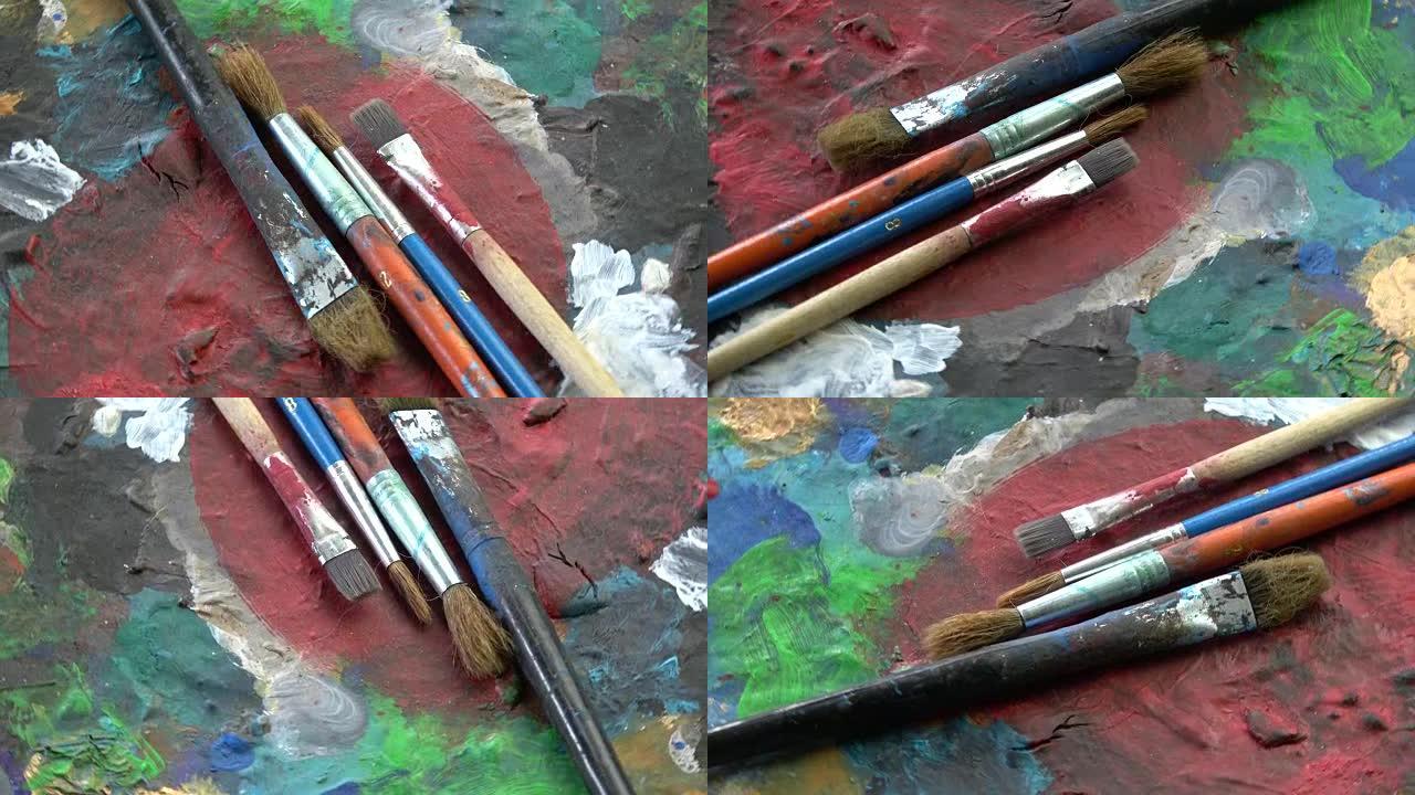 旋转画家艺术家旧调色板与画笔