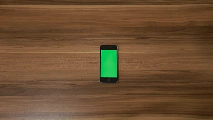 智能手机双击木桌背景手势。垂直