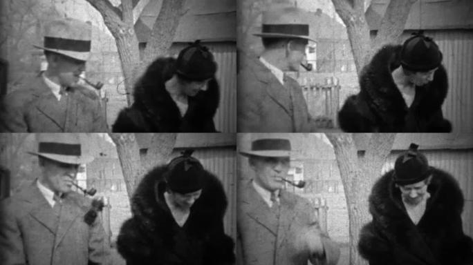 1933: 男人吸烟烟斗妻子在黑色皮草大衣与有趣的正式帽子。