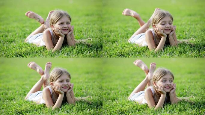 躺在草地上微笑的女孩