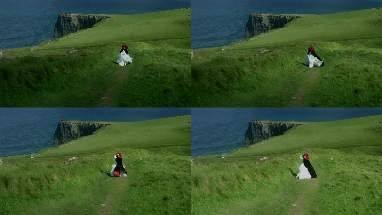 4k拍摄的红发公主在爱尔兰Moher View的悬崖上行走