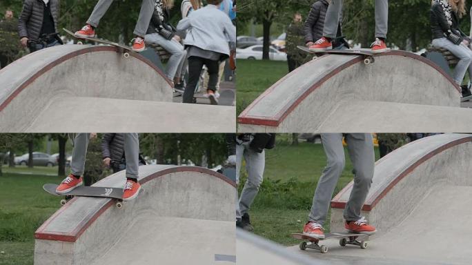 一个穿着红鞋的年轻人在滑板公园的壁架上做滑板戏