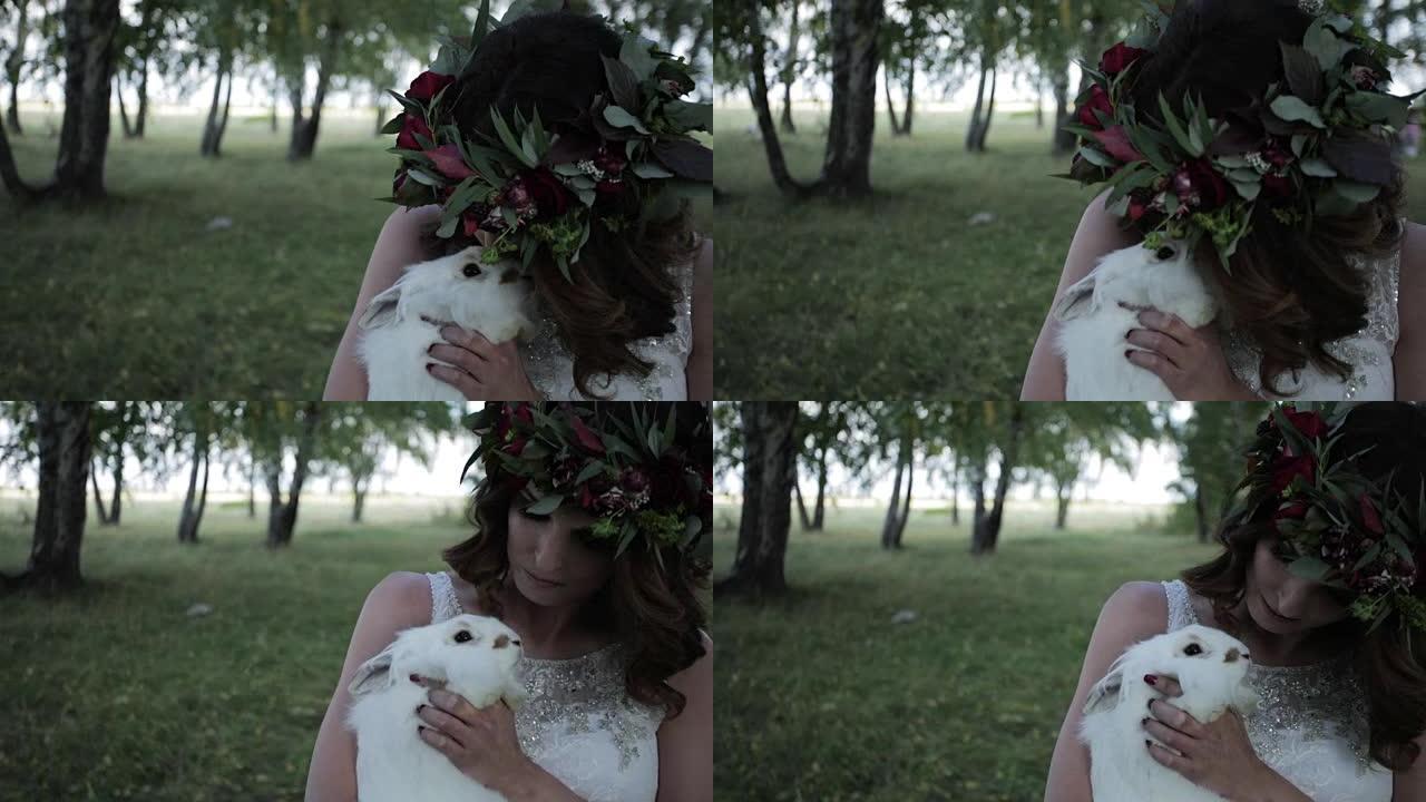 新娘爱抚森林中的兔子特写