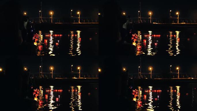 夜间河上的浮动照明灯笼节