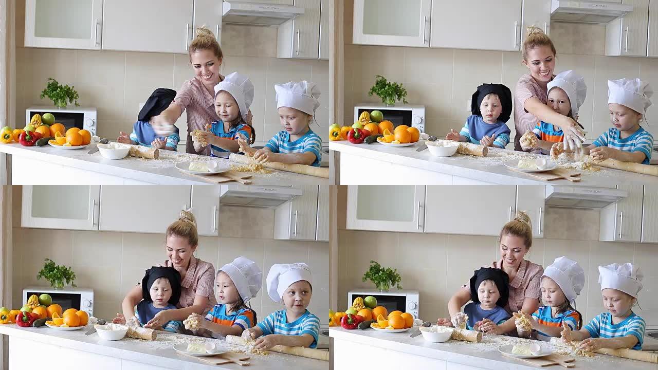 小厨师学习烹饪。有孩子在厨房的母亲