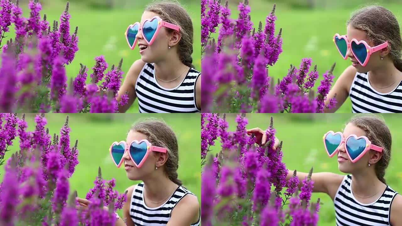 紫色花朵附近心形大眼镜的美丽女孩