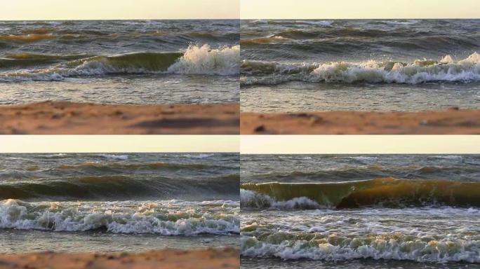 日落时的海浪。海滩上美丽的暴风雨天气。慢动作