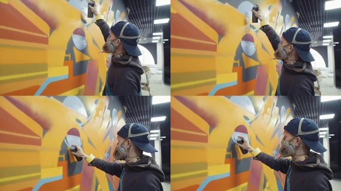 涂鸦艺术家在墙上绘画，室内