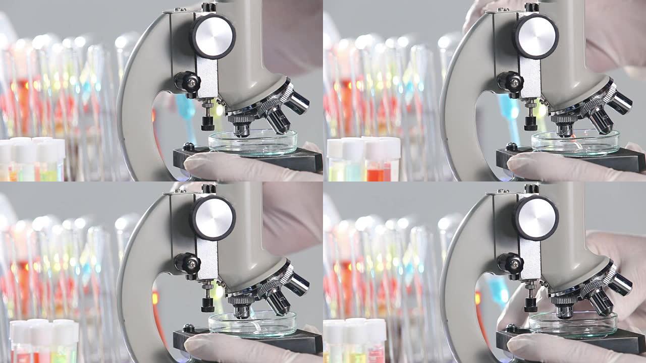 医生手检显微镜与玻璃管液体背景旋转