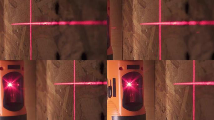 建筑激光水平仪和墙壁表面上标记的红线