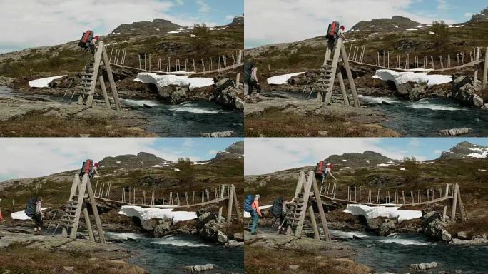 背包客在挪威的河上过桥