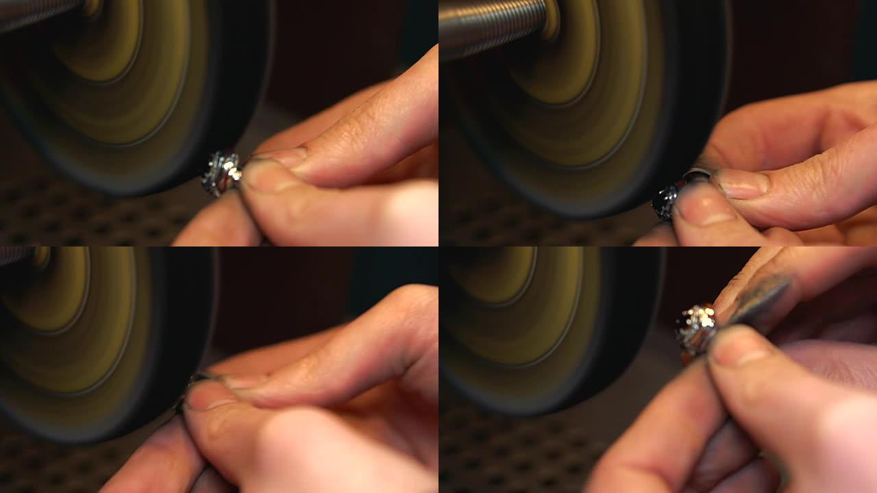 在抛光设备上抛光银环的过程特写是制作环的最后阶段