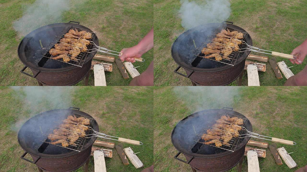 手把肉放在烤架上，烧烤木炭